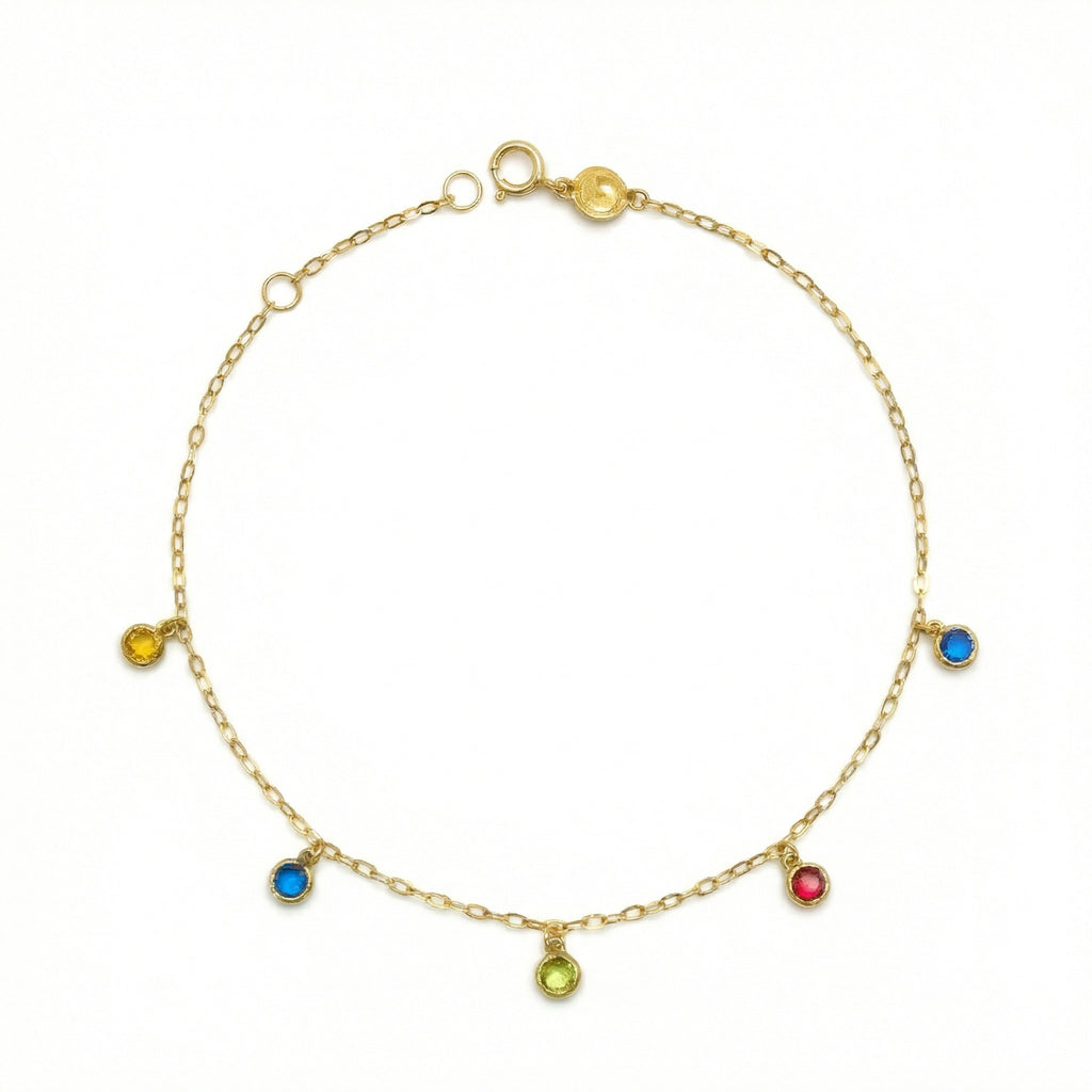 Gold anklet with colorful gemstones on a white background