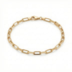 Gold chain bracelet on a white background