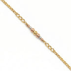 Gold chain bracelet with three different gold tones on a white background