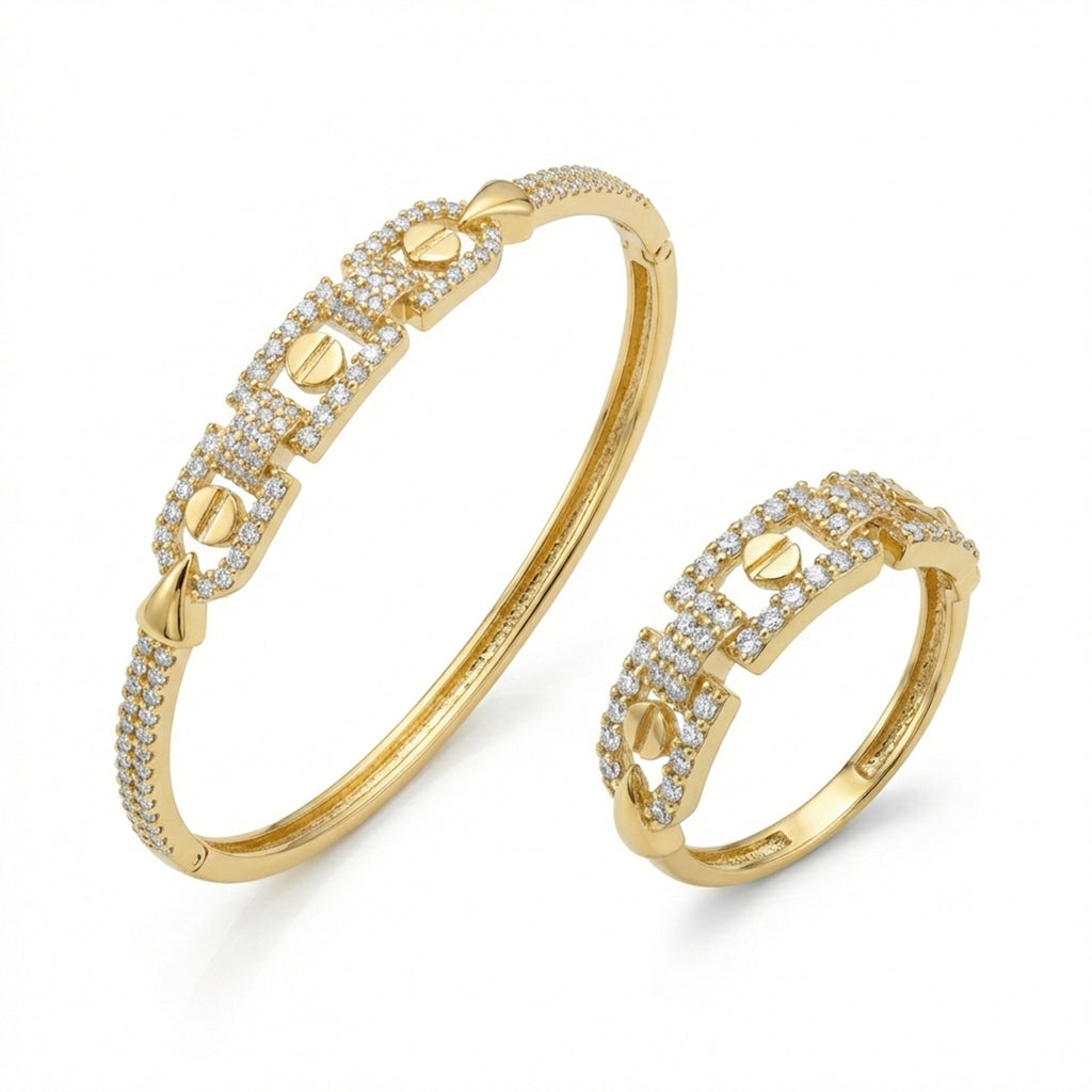 Gold bracelet and ring set on a white background