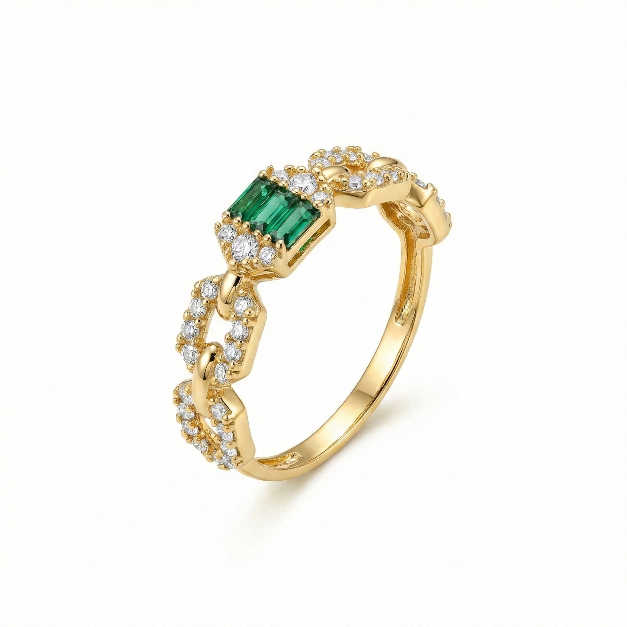 Gold ring with emerald and diamonds on a white background