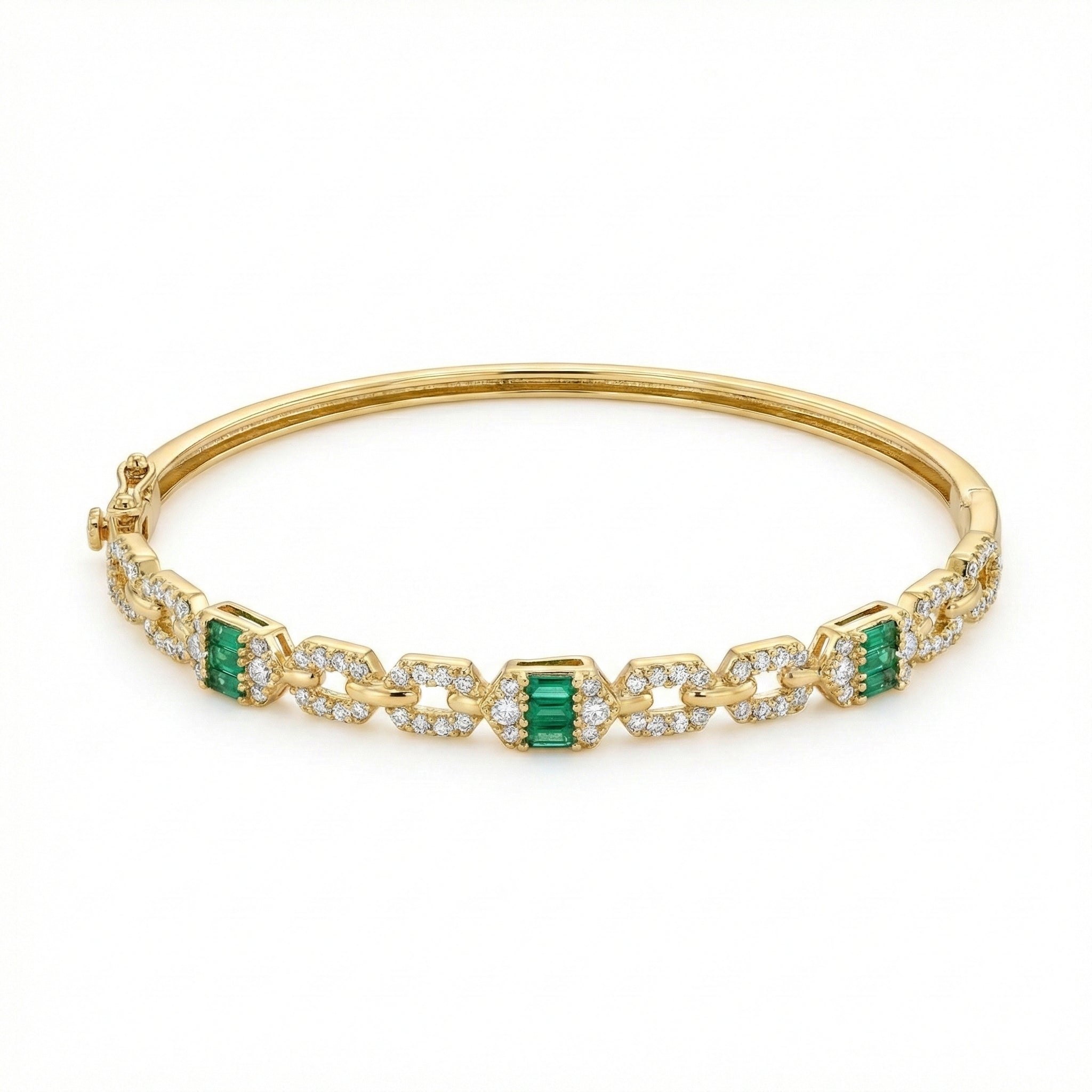 Gold bracelet with emerald and diamond accents on a white background
