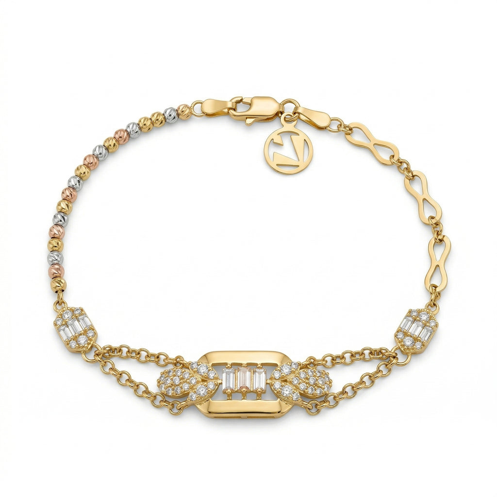 Lazurde 18k yellow gold bracelet on a pure white background. The piece features a central rectangular gold plaque set with three vertical baguette-cut diamonds and pavé-set accents, connected to a chain of tri-color gold beads and infinity-shaped links with a signature Lazurde logo charm.