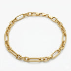 A Wassef 18k yellow gold Grommet link bracelet displayed on a pure white background, highlighting its polished finish and rhythmic alternating link pattern.