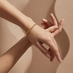 Wassef 18k yellow gold Gourmet bracelet styled on a feminine wrist with an elegant sculptural hand pose.