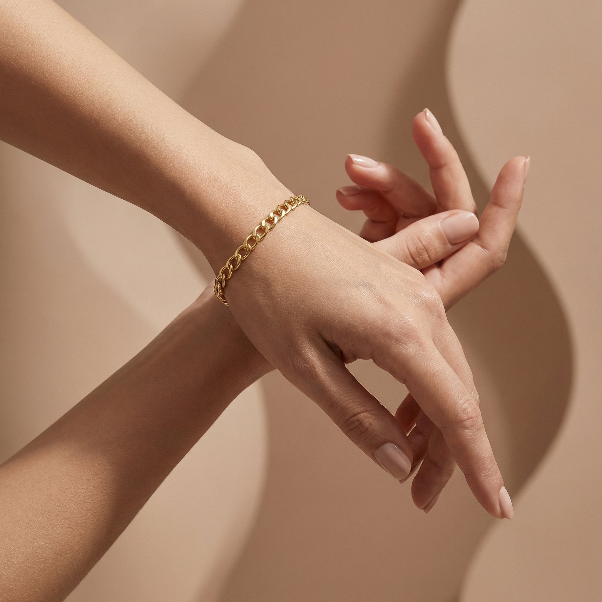 Wassef 18k yellow gold Gourmet bracelet styled on a feminine wrist with an elegant sculptural hand pose.