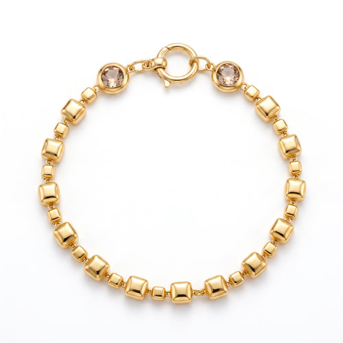 L'azurde 18k yellow gold square link bracelet with light brown stones and a round clasp, pure white background.	انسيال لازوردي ذهب أصفر عيار 18 بحلقات مربعة وأحجار بنية فاتحة وقفل دائري، على خلفية بيضاء نقية.