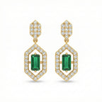 Gold earrings with green gemstones and diamond accents on a white background