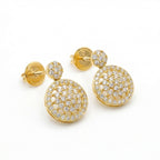 Gold earrings with diamond accents on a white background