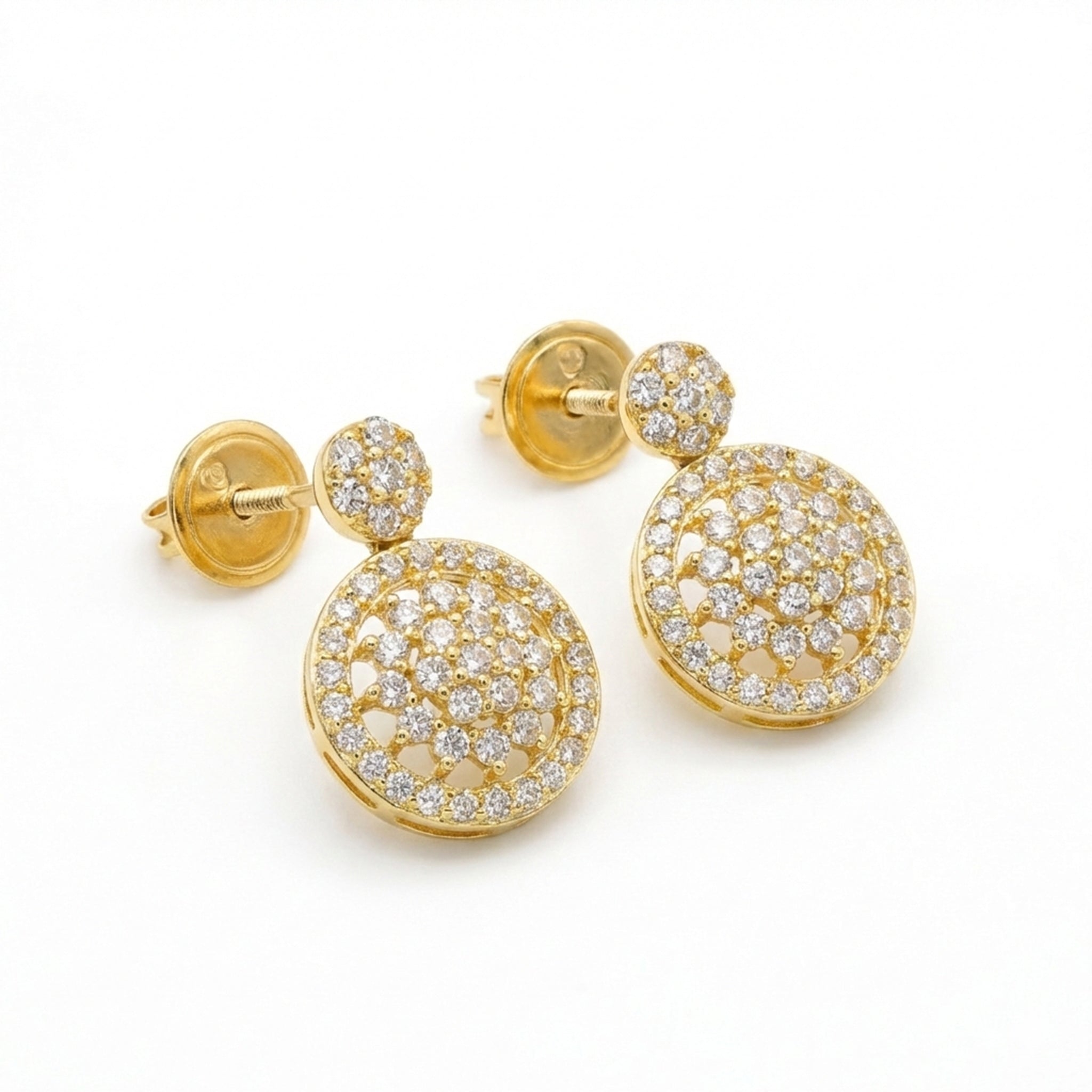 Gold earrings with diamond accents on a white background