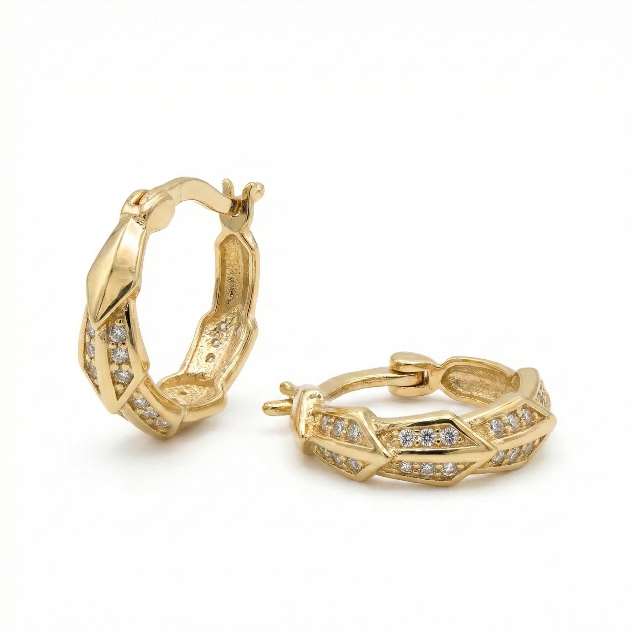 Gold hoop earrings with diamond accents on a white background