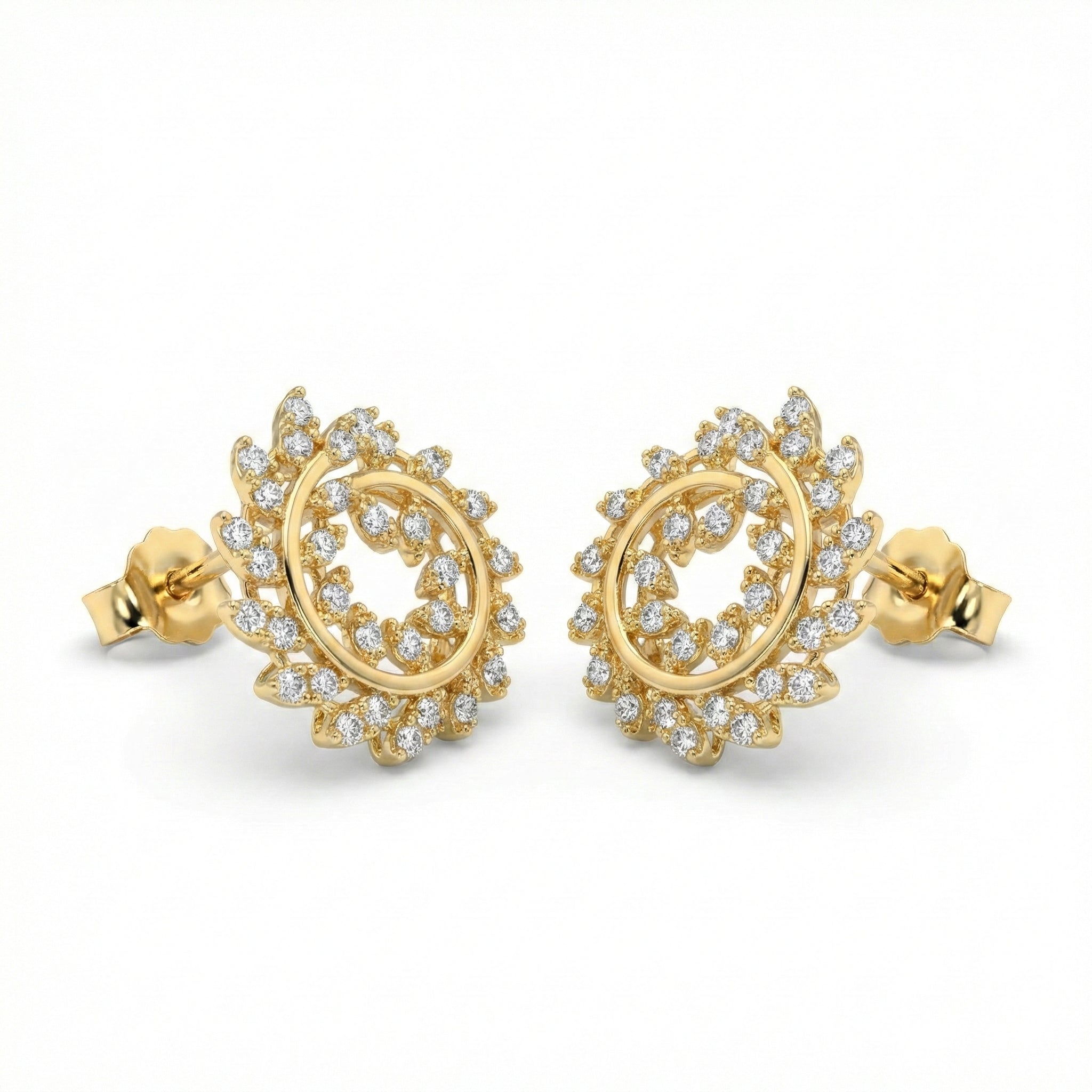 Gold earrings with diamond accents on a white background