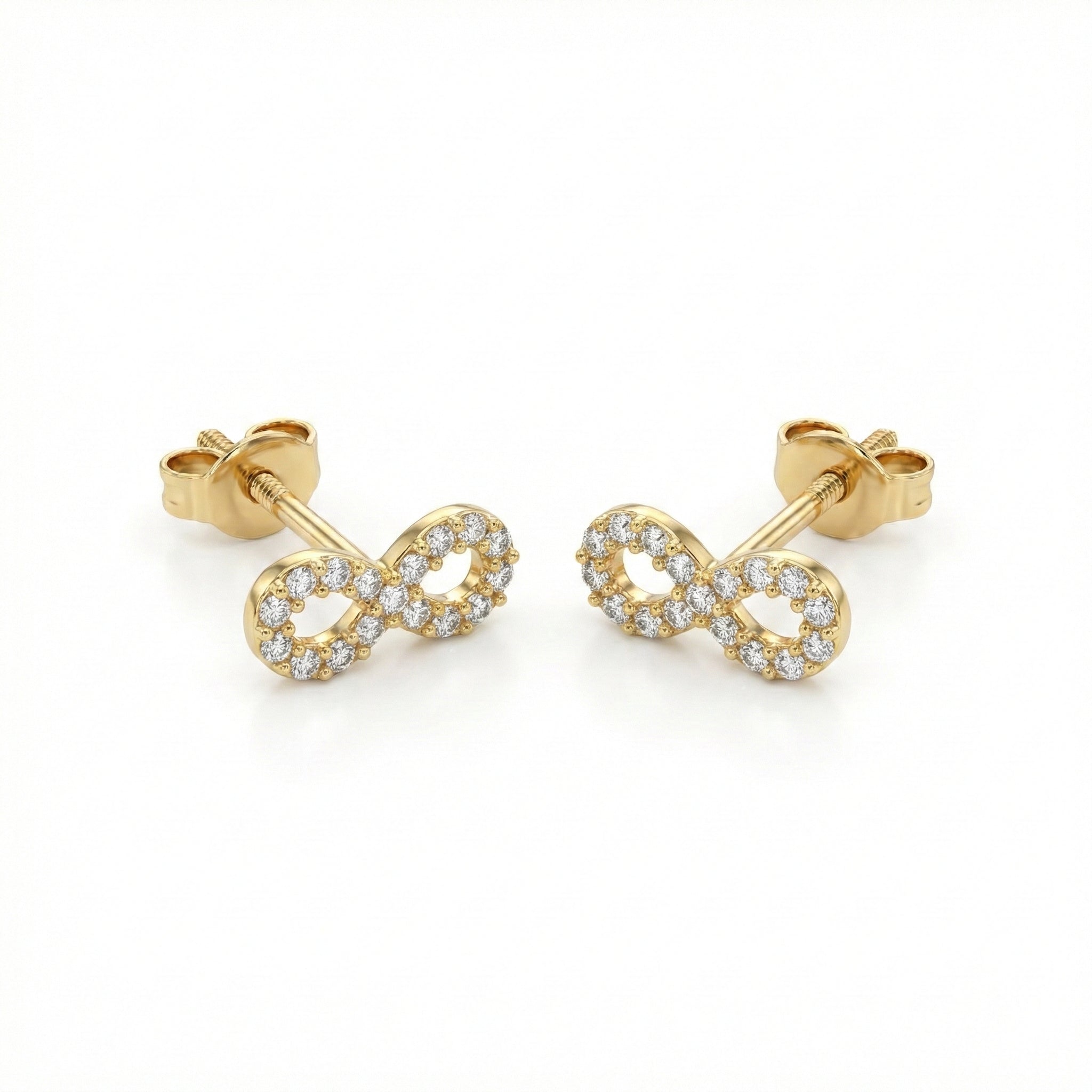 Gold infinity symbol earrings with clear stones on a white background