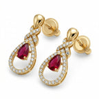 Lazurde 18k yellow gold drop earrings featuring a pear-shaped crimson center stone surrounded by a diamond-accented halo and crossover design, presented on a pure white background.