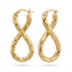 UNO brand 18k yellow gold infinity shaped textured hoop earrings on a pure white background.
حلق دهب عيار 18 ماركة أونو بتصميم إنفينيتي بارز على خلفية بيضا