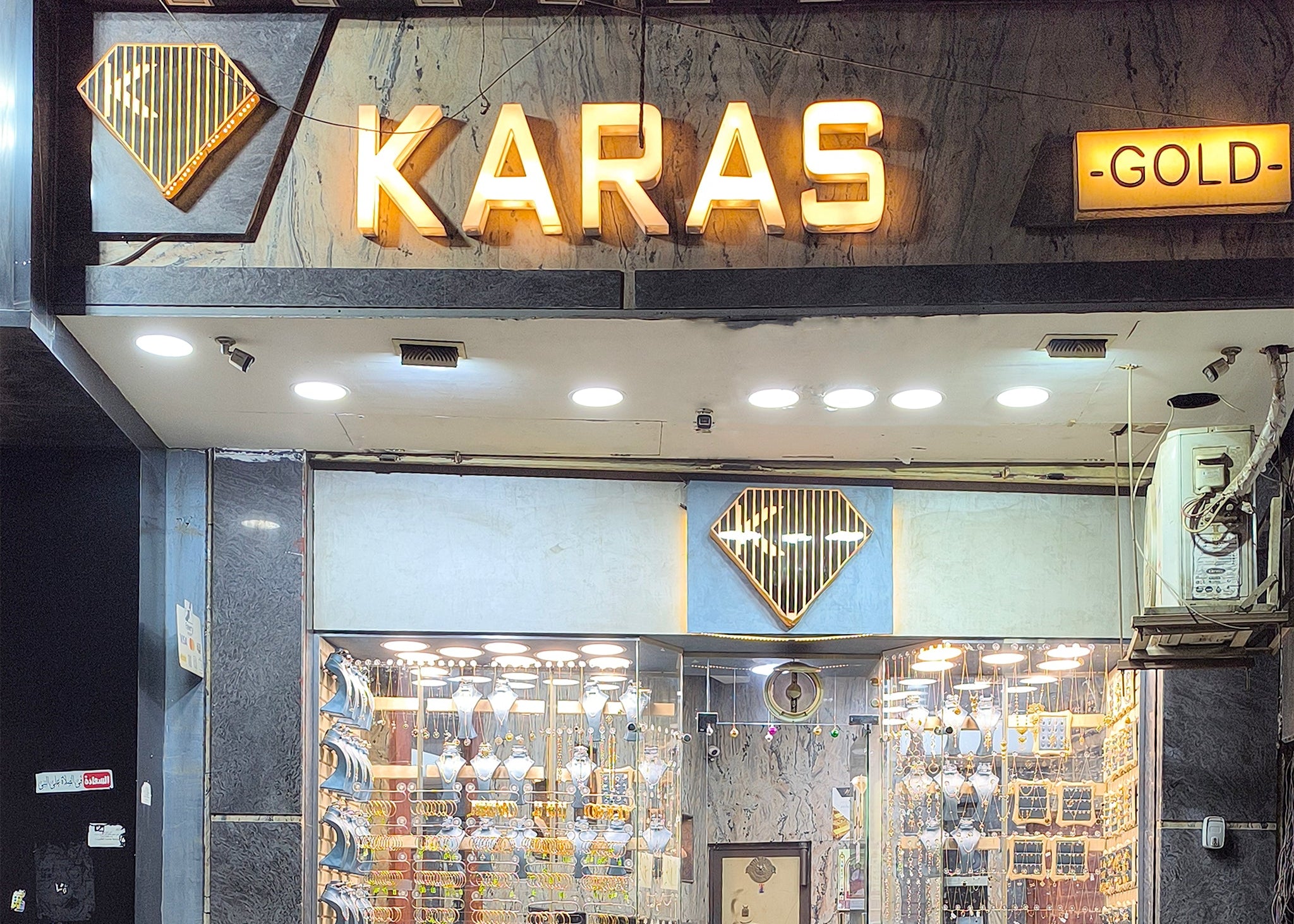 Karas Gold store front with jewelry display inside