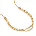 Gold chain necklace with gemstone beads on a white background