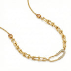 Gold chain necklace with gemstone beads on a white background