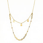 Gold necklace with star pendants on a white background