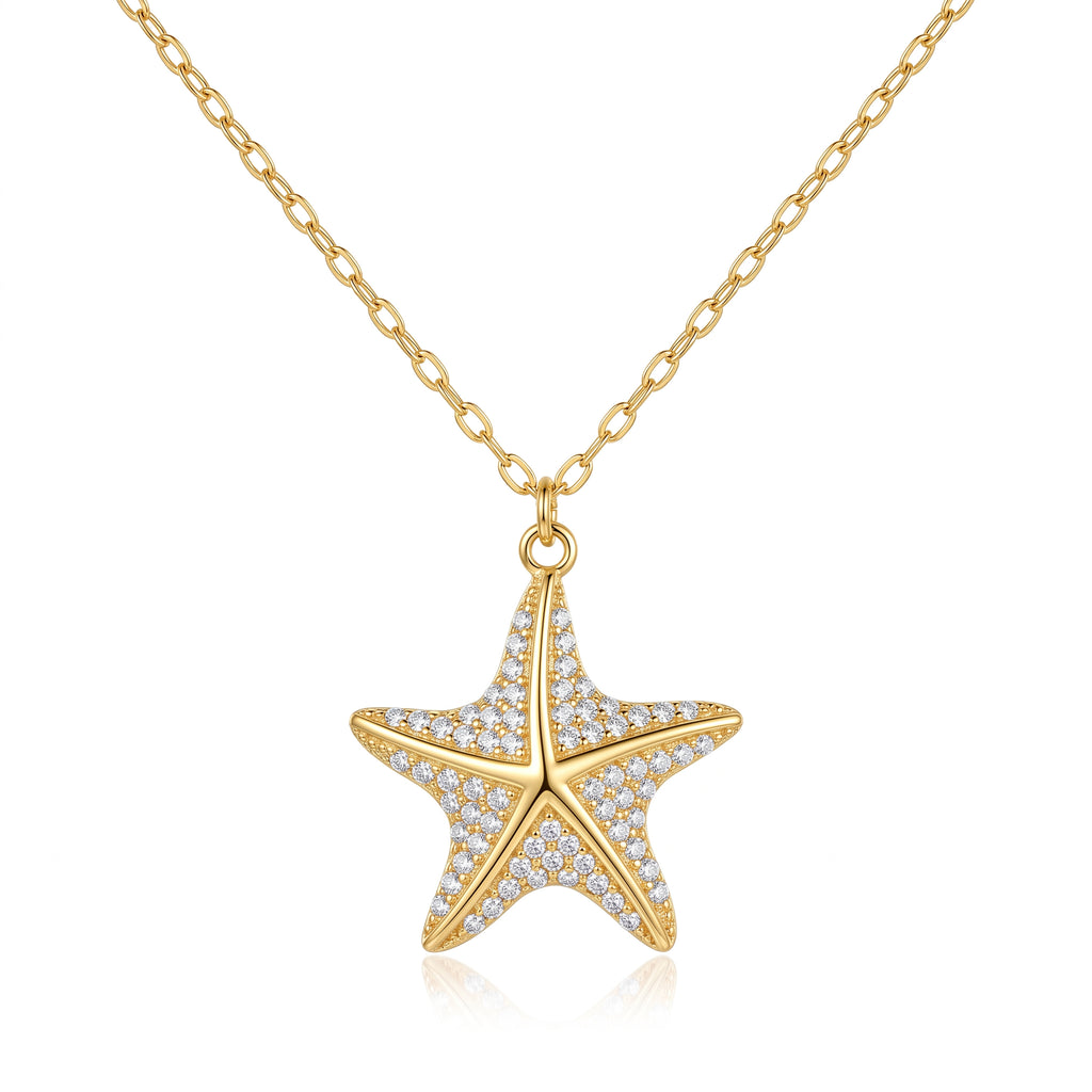 18k yellow gold starfish pendant necklace by Remas Gold featuring delicate pave detailing against a pure white background.
سلسلة دهب عيار 18 بدلاية نجمة البحر من ريماس جولد بتفاصيل فصوص لامعة على خلفية بيضاء نقية.