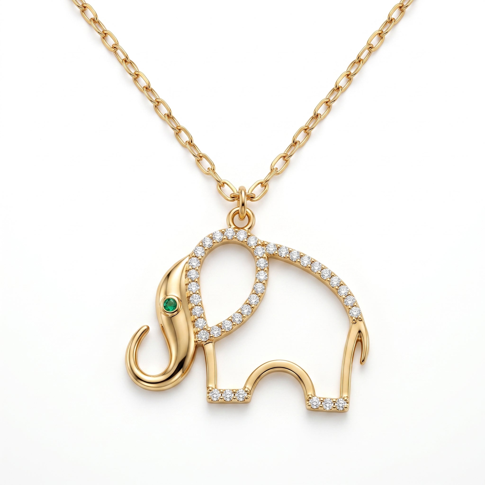 A professional studio shot of a gold necklace with an openwork elephant pendant, isolated against a solid white background. The elephant's curved back is paved with small sparkling diamonds, and its eye is a tiny green emerald.
لقطة استوديو احترافية لقلادة ذهبية مع دلاية مفرغة على شكل فيل، معزولة على خلفية بيضاء سادة. يزدان منحنى ظهر الفيل بقطع ألماس صغيرة براقة، وعينه عبارة عن زمردة خضراء صغيرة.