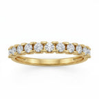 Front view of a Fine Gold 18k yellow gold wedding promise ring lying flat on a pure white background. The ring belongs to The Forever Edit category and features a delicate half-eternity band set with 11 brilliant round stones.