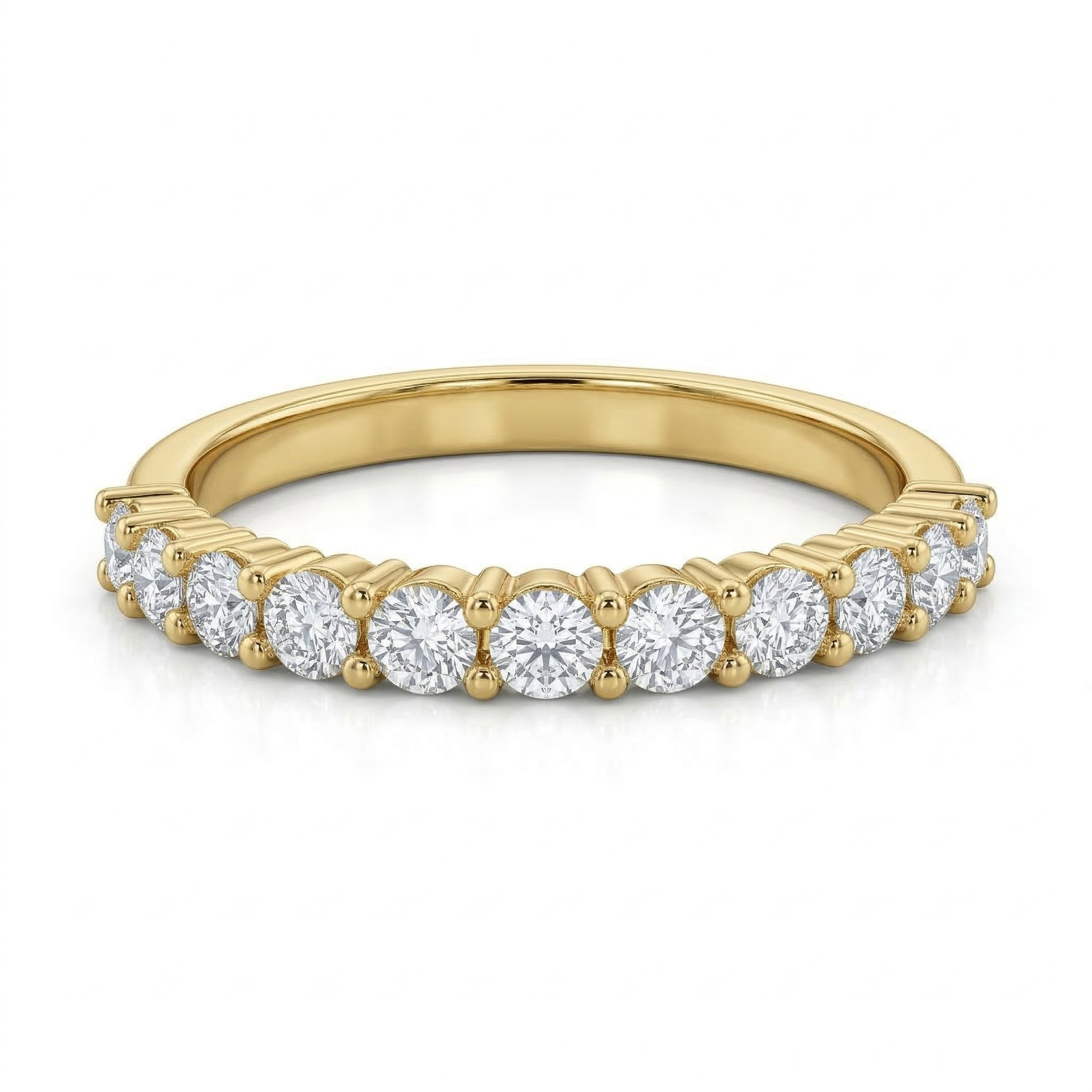Front view of a Remas 18k yellow gold promise ring lying flat against a pure white background. Belonging to The Forever Edit collection, the ring showcases 13 sparkling stones beautifully aligned along a delicate gold band.