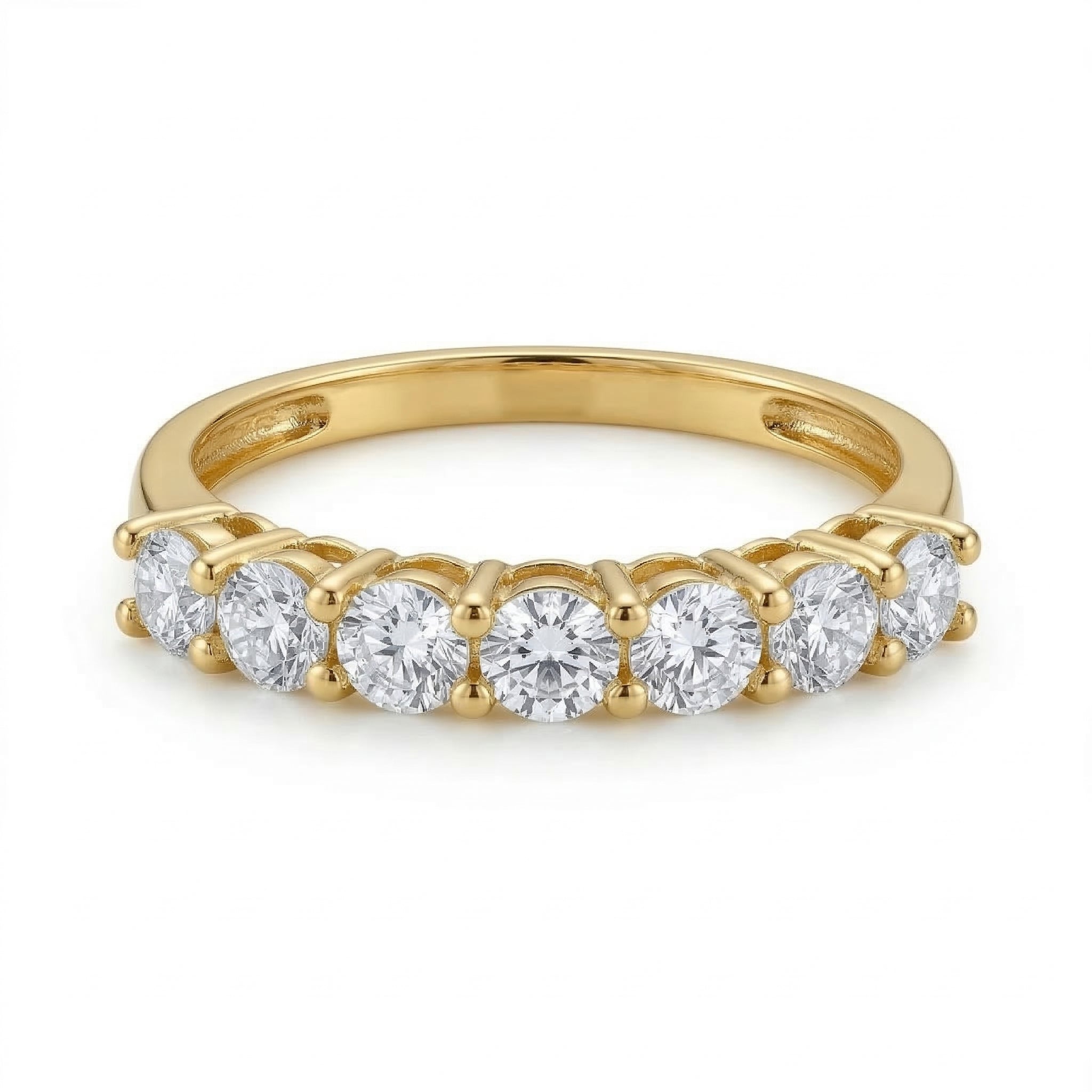 Fine Gold 18k yellow gold promise ring from The Forever Edit collection, showcasing seven brilliant stones, lying flat and viewed straight-on against a pure white background to highlight the band's structure.