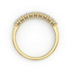 Top-down view of the Fine Gold 18k yellow gold wedding promise ring lying flat on a pure white background, highlighting the nine-stone setting of this elegant piece from The Forever Edit category.