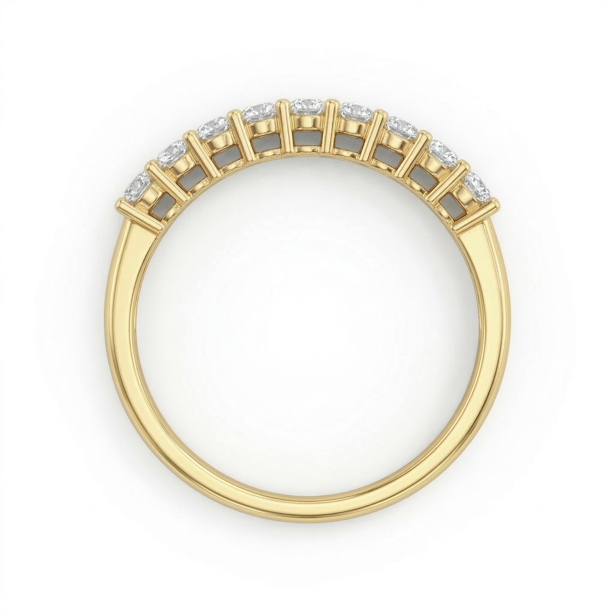 Top-down view of the Fine Gold 18k yellow gold wedding promise ring lying flat on a pure white background, highlighting the nine-stone setting of this elegant piece from The Forever Edit category.