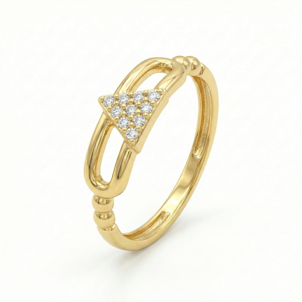 Gold ring with diamond accents on a white background
