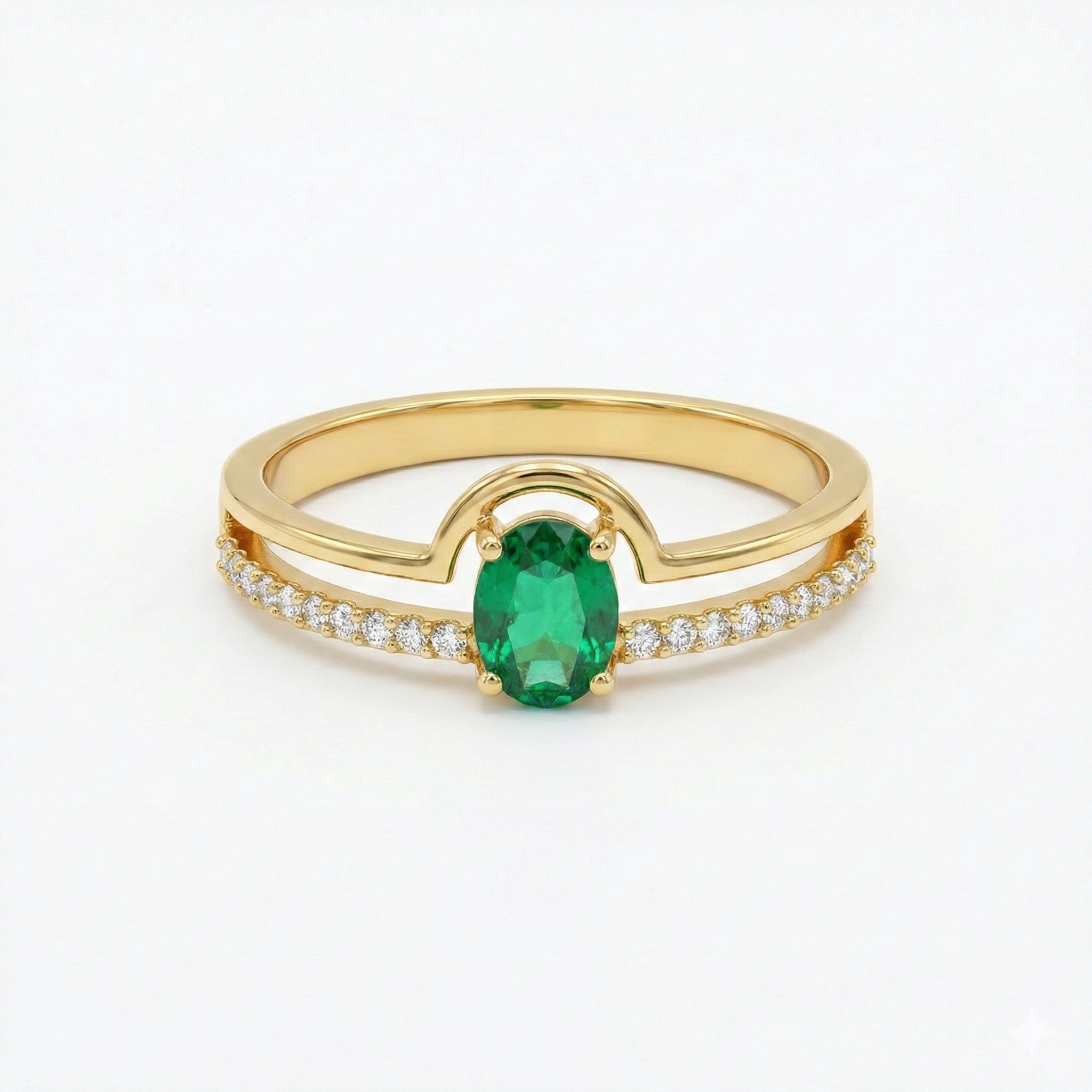 Gold ring with a green gemstone and small white stones on a white background
