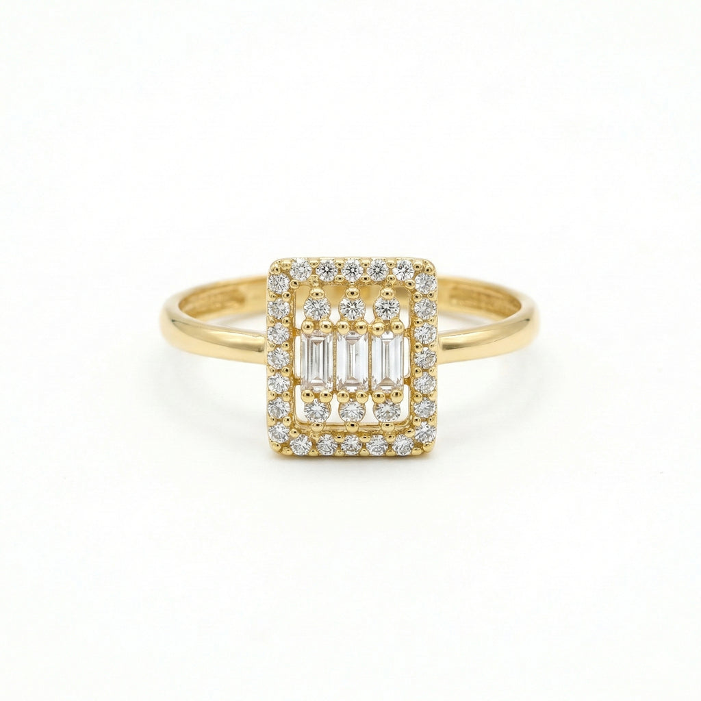 Gold ring with diamond accents on a white background