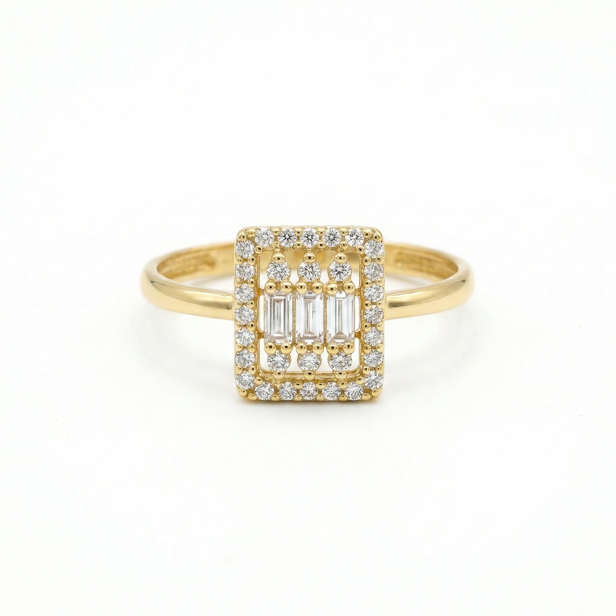 Gold ring with diamond accents on a white background