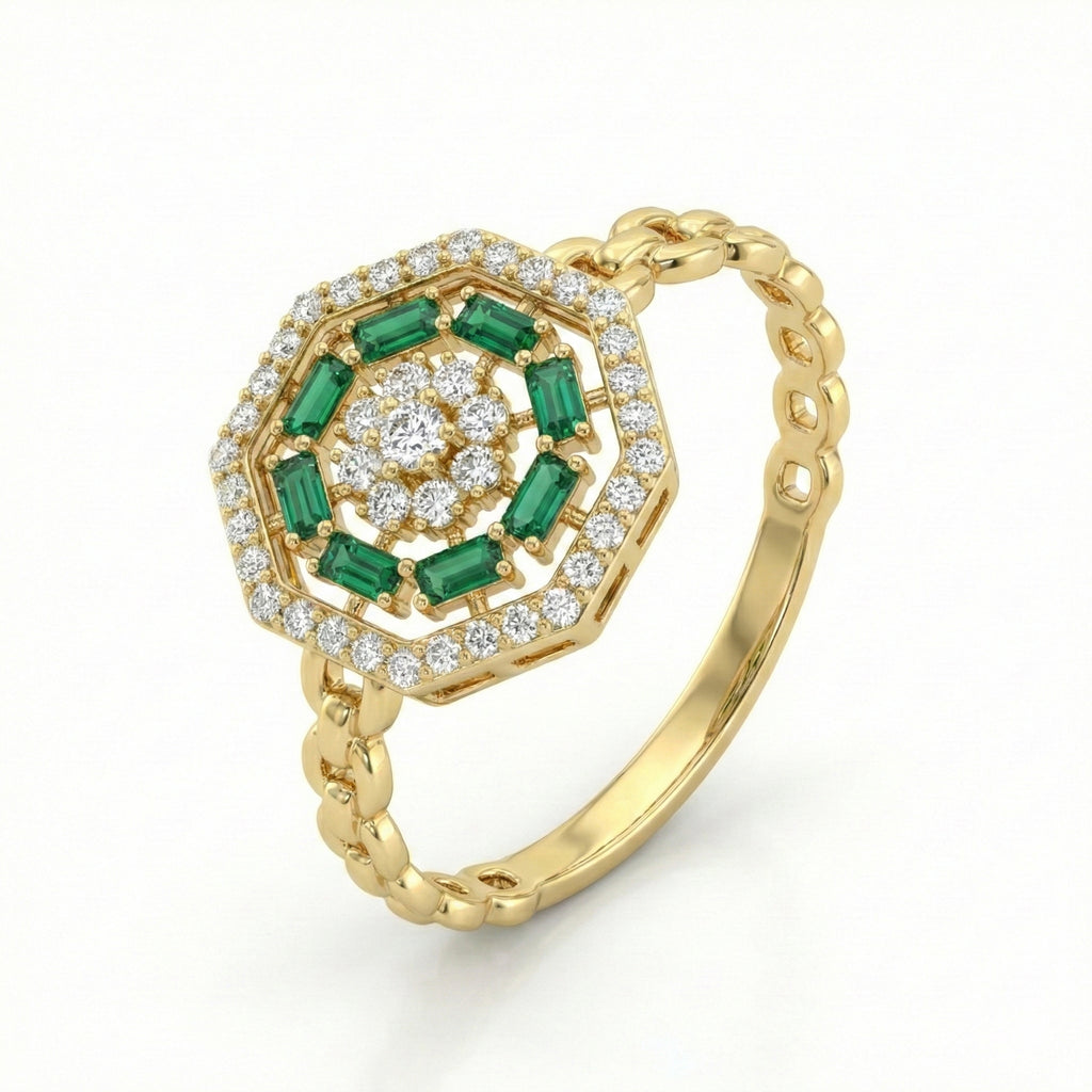 Gold ring with emerald and diamond design on a white background
