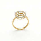 Gold ring with diamond accents on a white background