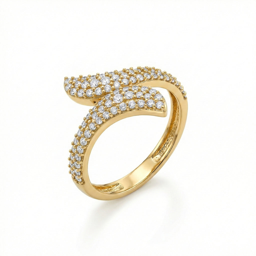 Gold ring with diamond accents on a white background