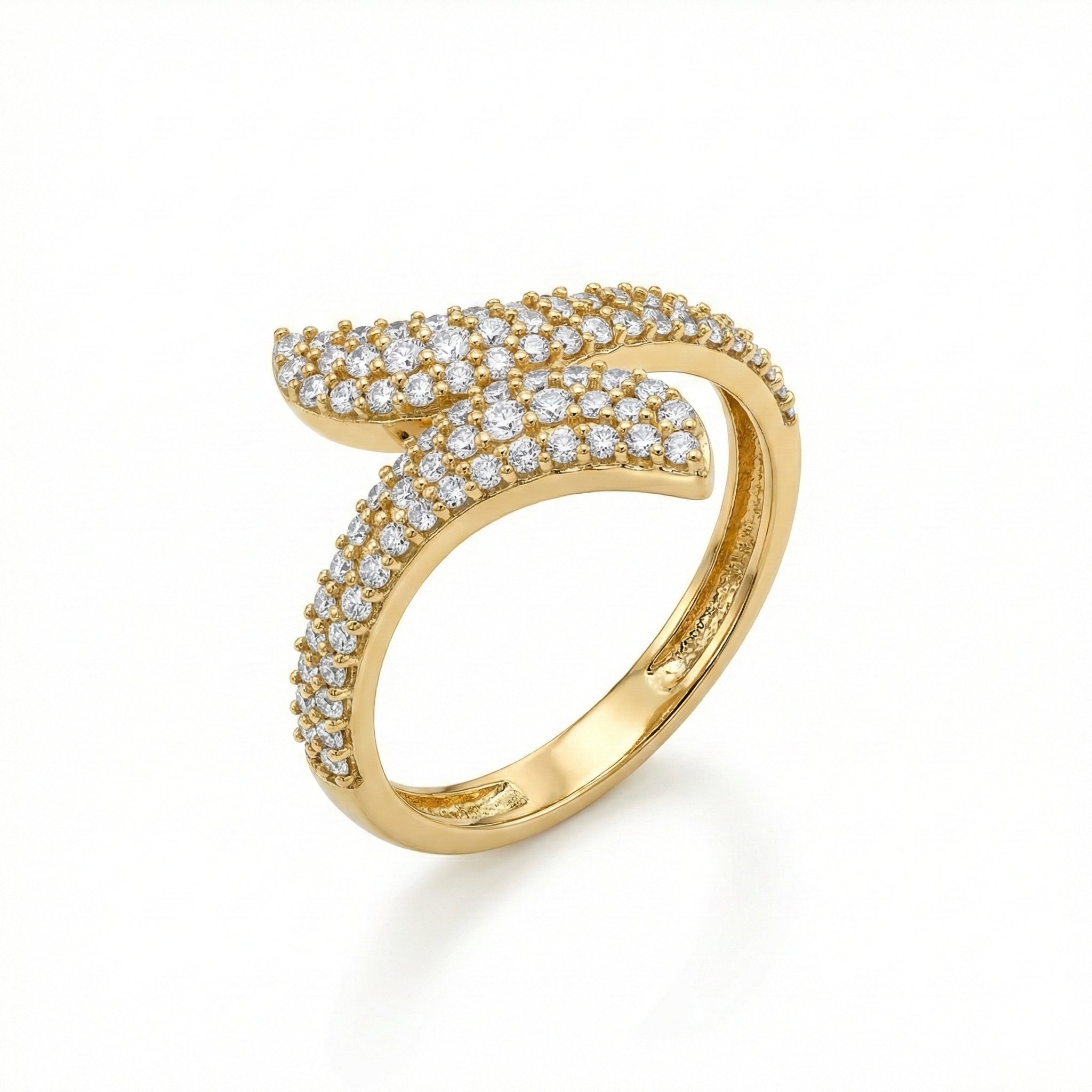 Gold ring with diamond accents on a white background
