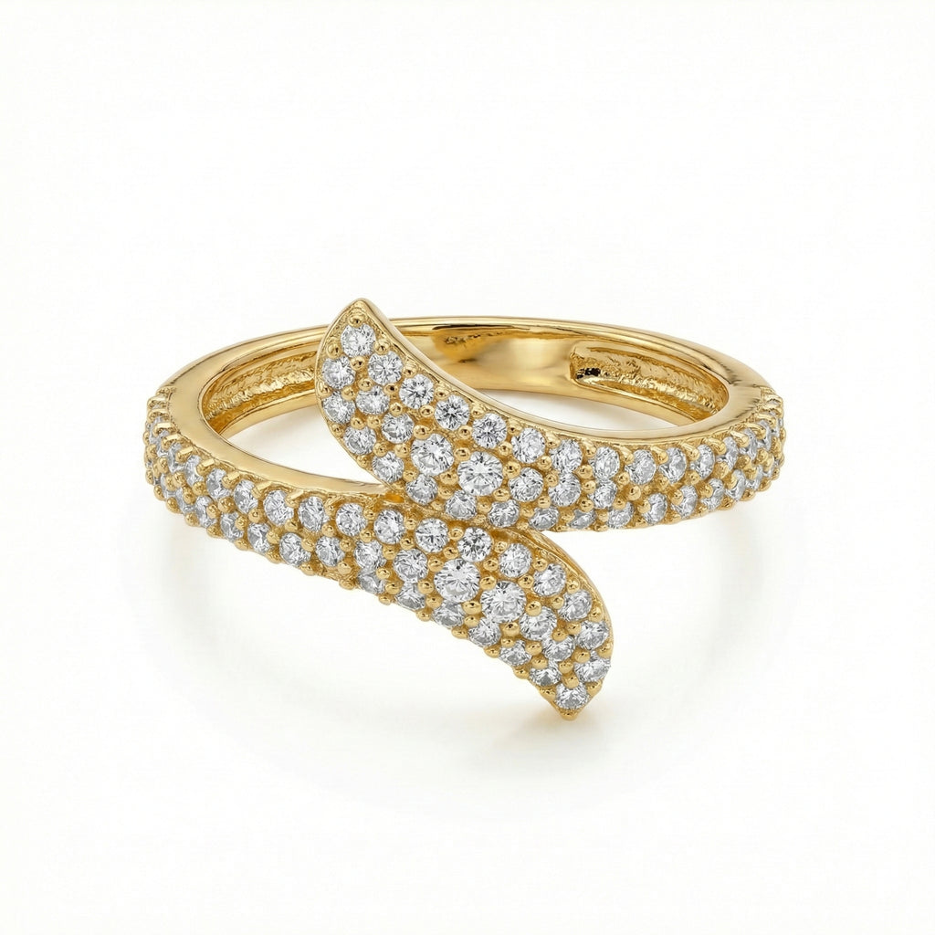 Gold ring with diamond accents on a white background