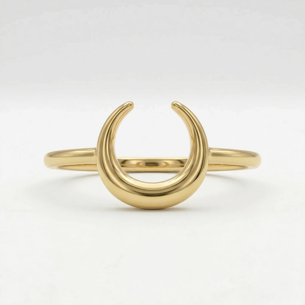 Front view of a Lamar 18k yellow gold crescent moon ring, lying flat against a crisp, pure white background to showcase its polished structural details.