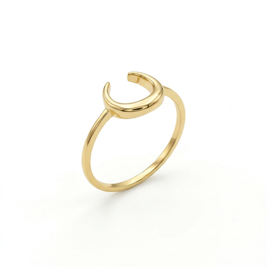 Lamar 18k yellow gold ring featuring a minimalist open crescent moon design, standing upright at a three-quarter angle on a pure white background.