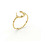 Lamar 18k yellow gold ring featuring a minimalist open crescent moon design, standing upright at a three-quarter angle on a pure white background.