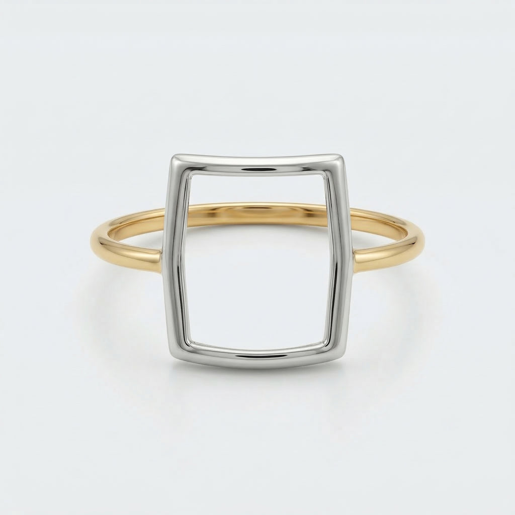Front flat-lay view of the Alyans 18k yellow gold ring, lying against a crisp white background to clearly showcase its geometric mixed-metal structure.