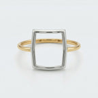 Front flat-lay view of the Alyans 18k yellow gold ring, lying against a crisp white background to clearly showcase its geometric mixed-metal structure.