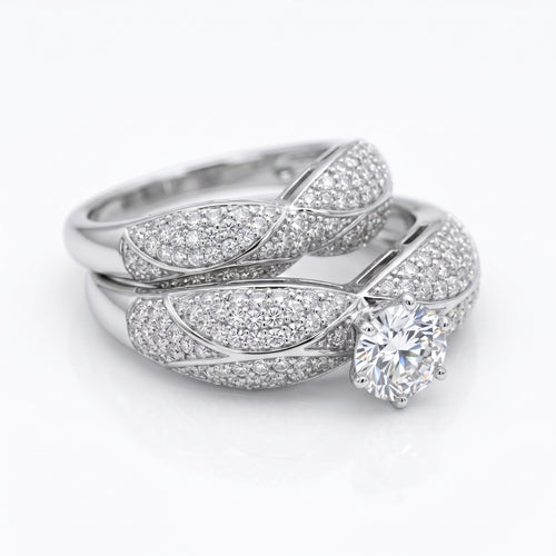 L'azurde 18k white gold twin ring set weighing 10.36g featuring sparkling simulated stones on a pure white background.	طقم خواتم توينز من لازوردي ذهب أبيض عيار 18 بوزن 10.36 جرام مع أحجار لامعة على خلفية بيضاء نقية.