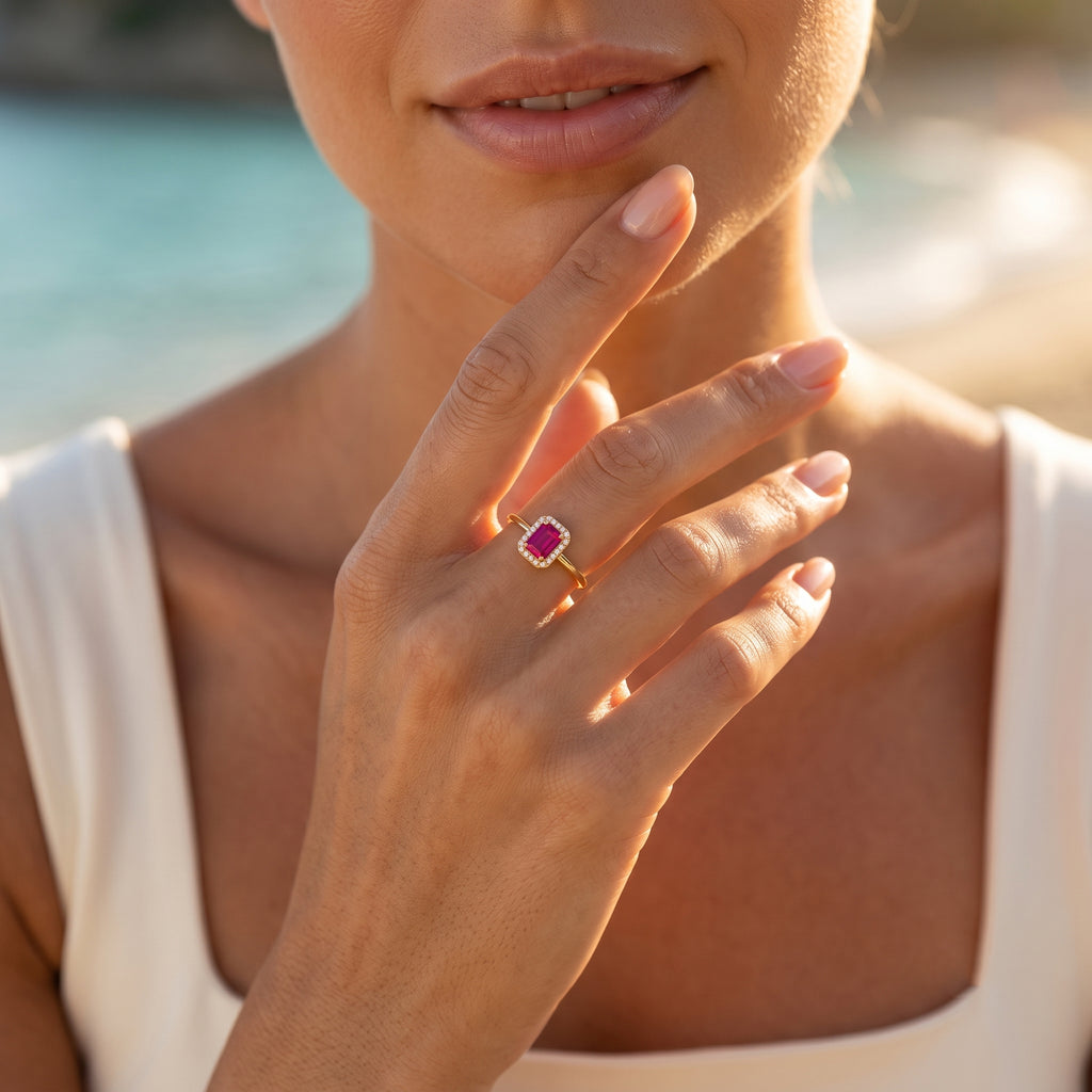 Extreme close-up of the delicate 0.96g King Gold ring on a woman's graceful hand against a softly blurred Mediterranean beach background.	لقطة مقربة جداً لخاتم كينج جولد الرقيق بوزن 0.96 جم على يد امرأة ناعمة بخلفية شاطئ ضبابية هادئة.