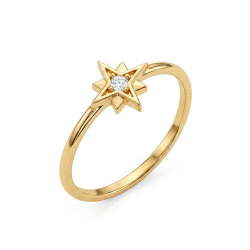 An angled product shot of a delicate 18k yellow gold star ring by Remas Gold featuring a central stone, set against a pure white background.	صورة تفصيلية بزاوية لمنتج خاتم نجمة رقيق من الذهب الأصفر عيار 18 من ريماس جولد يتوسطه فص، معروض على خلفية بيضاء نقية.