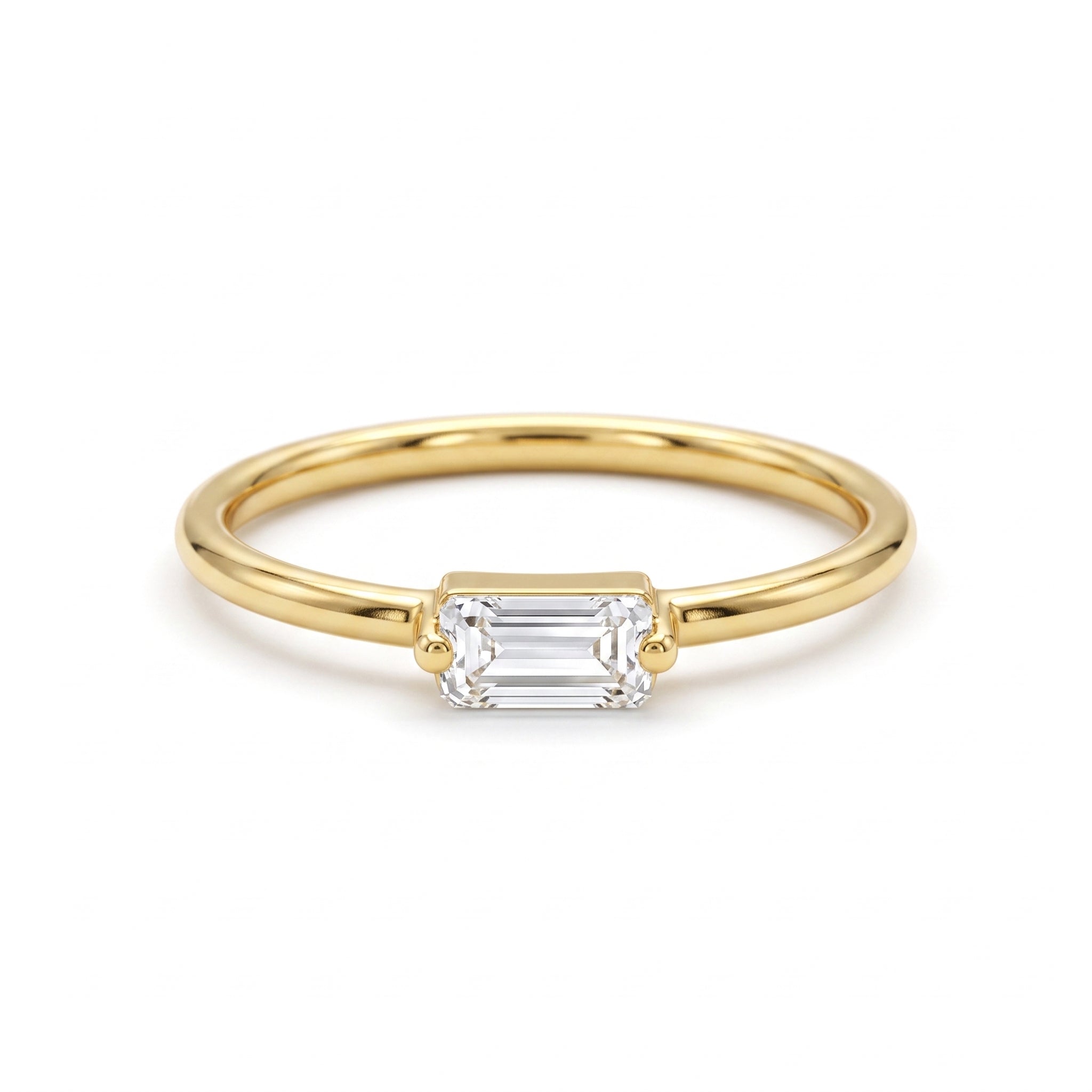 Andria 18k yellow gold sleek ring featuring a horizontal white stone, pure white background for e-commerce.	خاتم أندريا رقيق من الذهب الأصفر عيار 18 يتميز بفص أبيض أفقي، خلفية بيضاء نقية.