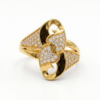 Andria gold interlocking heart ring with sparkling stones on a pure white background.	خاتم أندريا ذهب بتصميم قلوب متداخلة وأحجار براقة على خلفية بيضاء نقية.