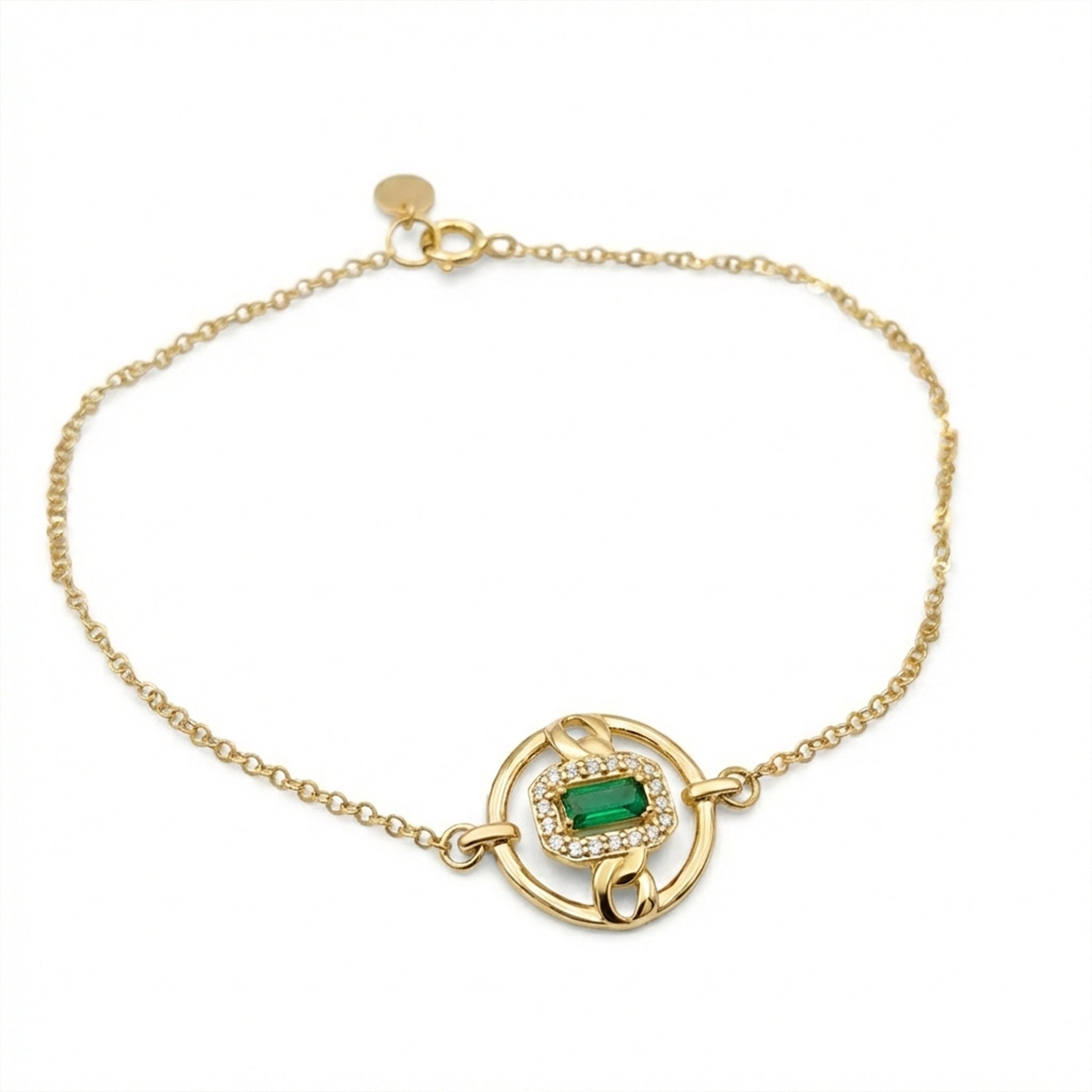 Gold bracelet with a green gemstone on a white background